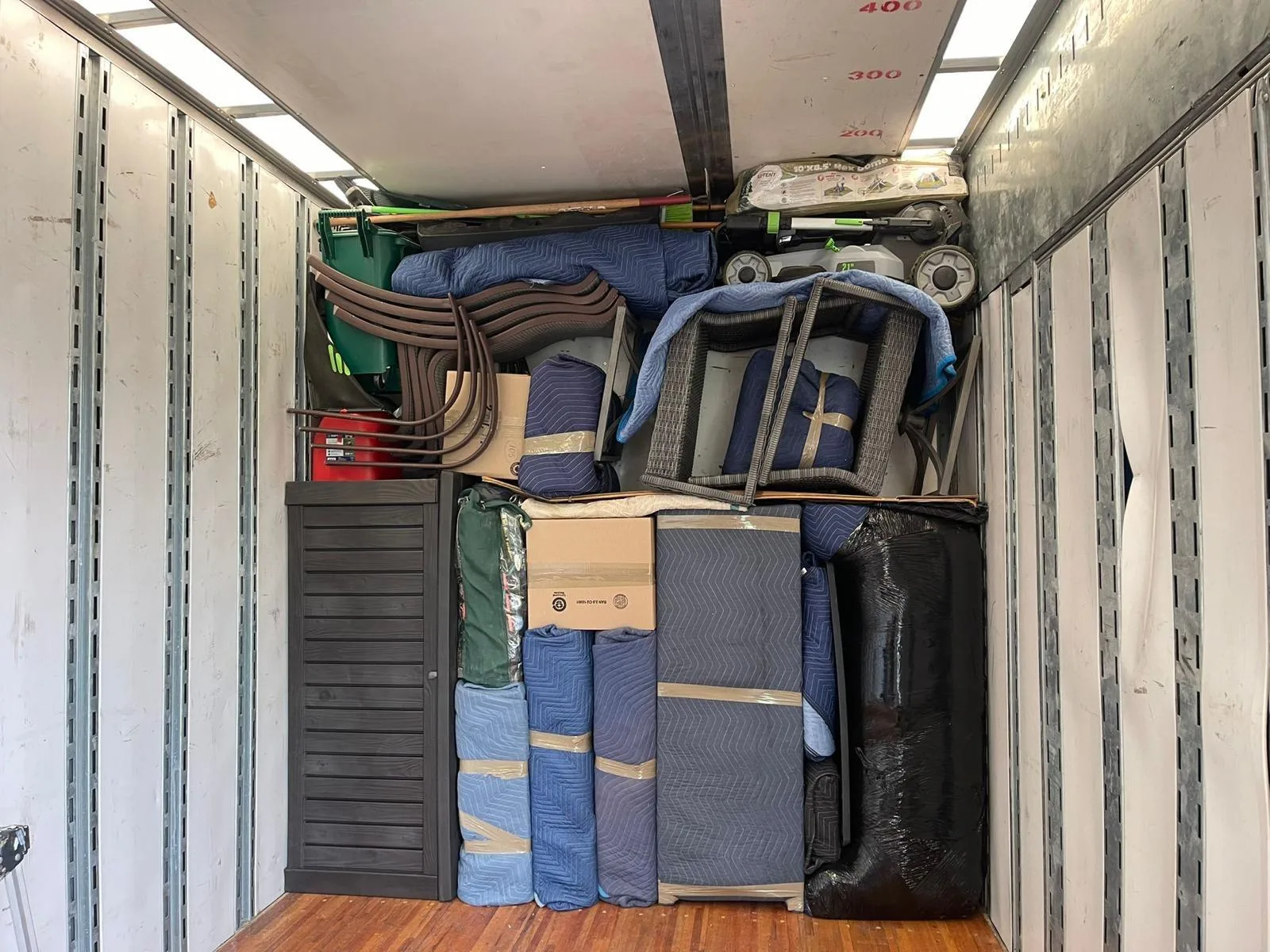 A household load wrapped and strapped inside a Klacar truck
